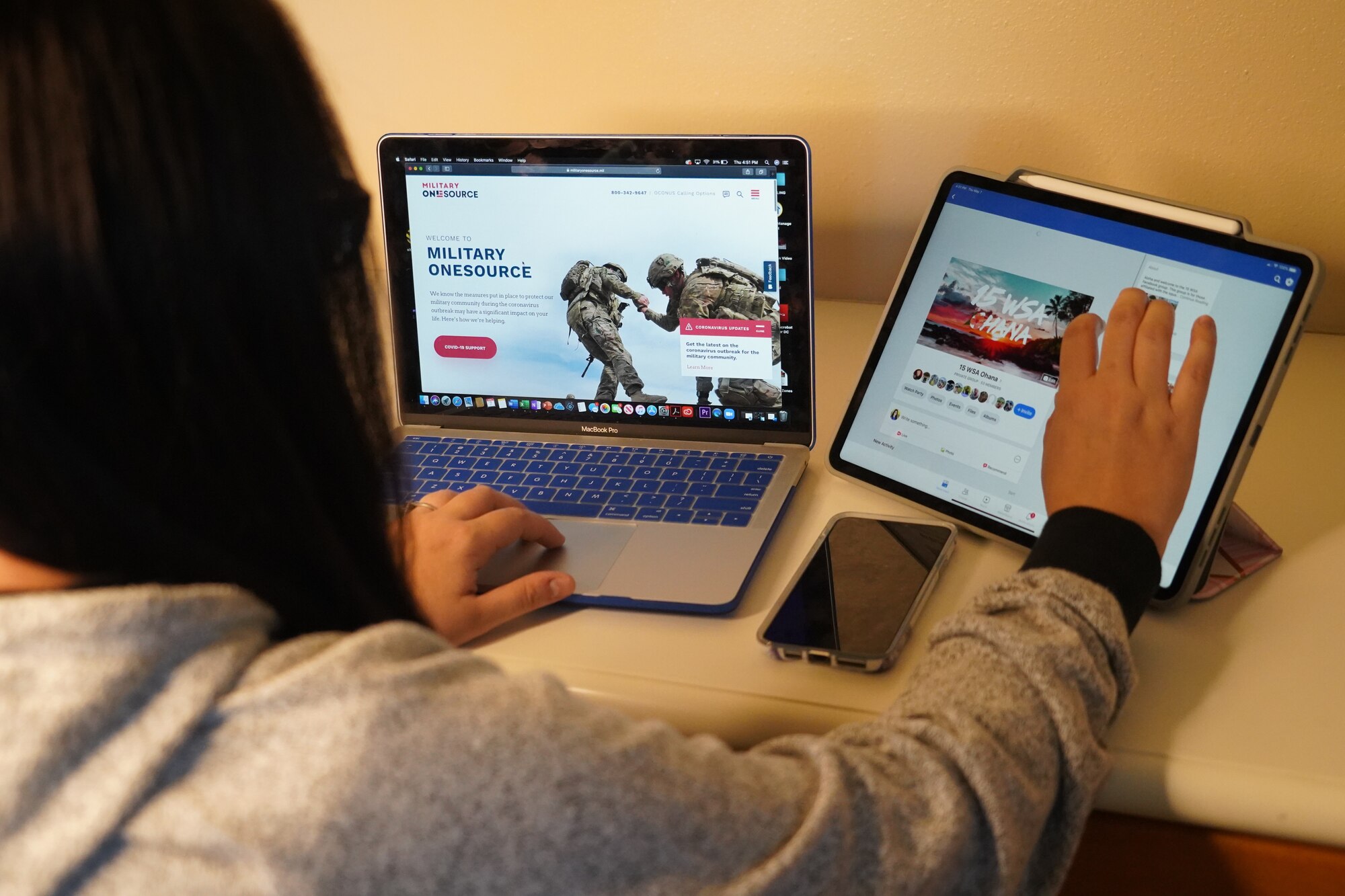 A 15th Wing spouse receives information through a key spouse Facebook page at Ewa Beach, Hawaii, May 7, 2020. The U.S. Air Force Key Spouse Program is an official Air Force Unit Family Readiness Program designed to enhance readiness, personal and family resiliency, and establish a sense of Air Force community. (U.S. Air Force photo by Staff Sgt. Nicholas Brown)