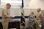 Rear Adm. Lorin Selby (left) reads off his orders relieving him of duties as Naval Sea Systems Command’s Chief Engineer while Rear Adm. (Sel.) Jason Lloyd awaits to read his own orders to assume his duties as the incoming CHENG May 8 during Naval Sea Systems Command (NAVSEA) Engineering Directorate’s change of office ceremony.