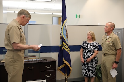 Rear Adm. Lorin Selby (left) reads off his orders relieving him of duties as Naval Sea Systems Command’s Chief Engineer while Rear Adm. (Sel.) Jason Lloyd awaits to read his own orders to assume his duties as the incoming CHENG May 8 during Naval Sea Systems Command (NAVSEA) Engineering Directorate’s change of office ceremony.