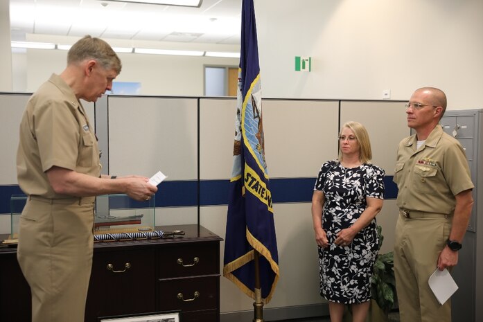 Rear Adm. Lorin Selby (left) reads off his orders relieving him of duties as Naval Sea Systems Command’s Chief Engineer while Rear Adm. (Sel.) Jason Lloyd awaits to read his own orders to assume his duties as the incoming CHENG May 8 during Naval Sea Systems Command (NAVSEA) Engineering Directorate’s change of office ceremony.