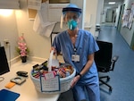 U.S. Air Fore Maj. Tori Scearbo, a 157th Medical Group, Det. 1 CERFP nurse, New Hampshire Air National Guard, at her civilian job as a critical care nurse at Portsmouth Hospital, April 26, 2020. Scearbo has been taking care of people with COVID-19.