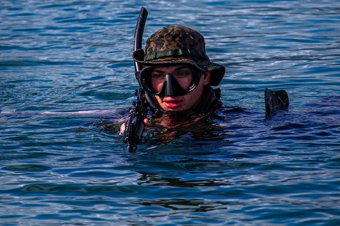 A U.S. Marine swims ashore during an amphibious assault exercise on Marine Corps Base Hawaii, April 28.