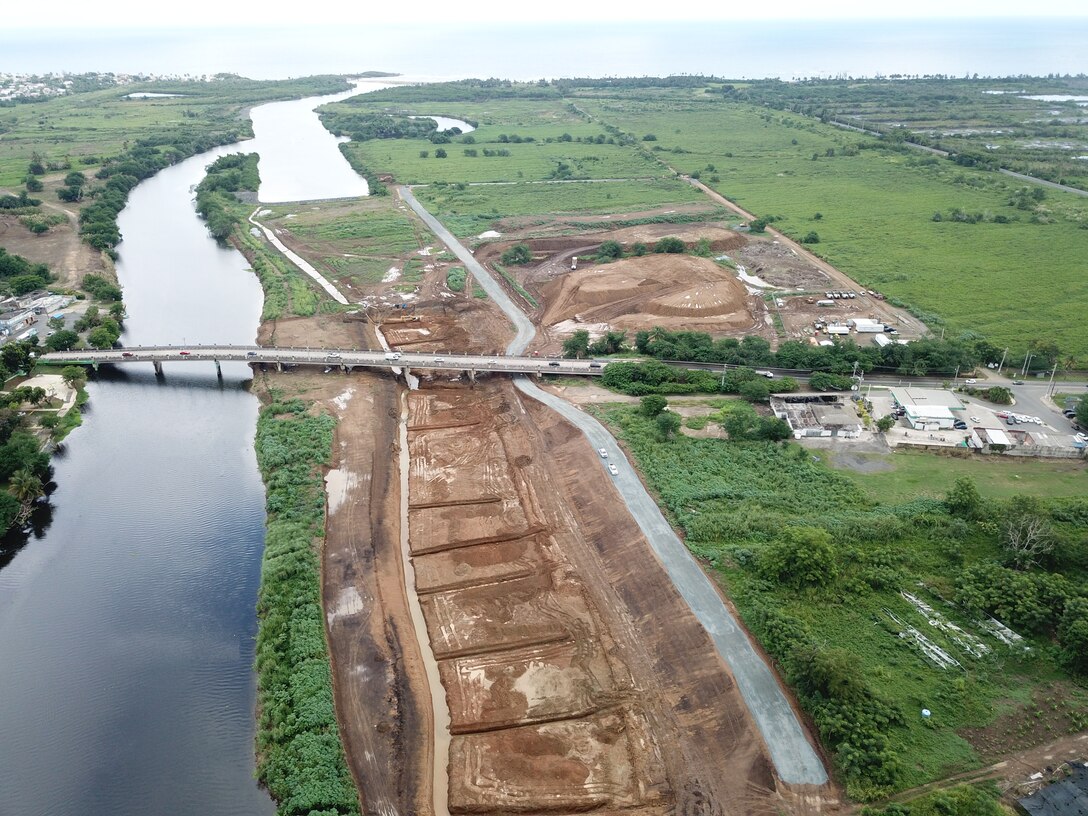 Rio de la Plata on the left hand side and construction project on the right, Dorado bridge can be seen across in the middle of the image.
