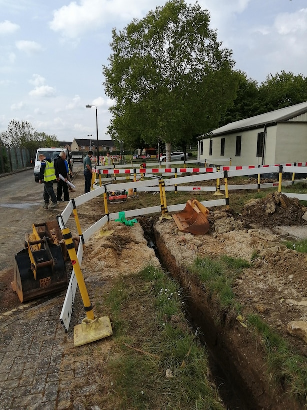 Contractors install new communication lines at RAF Fairford, England, May 4, 2020. Run by the 501st Combat Support Wing Plans and Programs Office, the project aims to recapitalize information technology infrastructure around the base, ensuring its networks are resilient and reliable for an expanding mission set (Courtesy photo)
