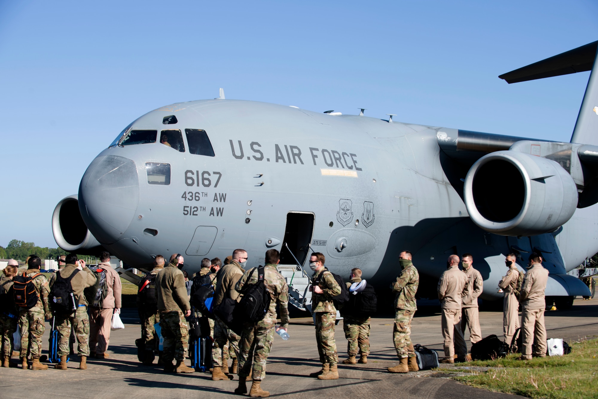 48th Fighter Wing Airmen wait to board a C-17 Globemaster III from Dover Air Force Base, Delaware, prior to a deployment from Royal Air Force Lakenheath, England, May 6, 2020. F-15E Strike Eagles and Airmen from the 492nd Fighter Squadron and supporting units across the 48th FW are currently deployed to an undisclosed location in Southwest Asia. (U.S. Air Force photo by Senior Airman Christopher S. Sparks)