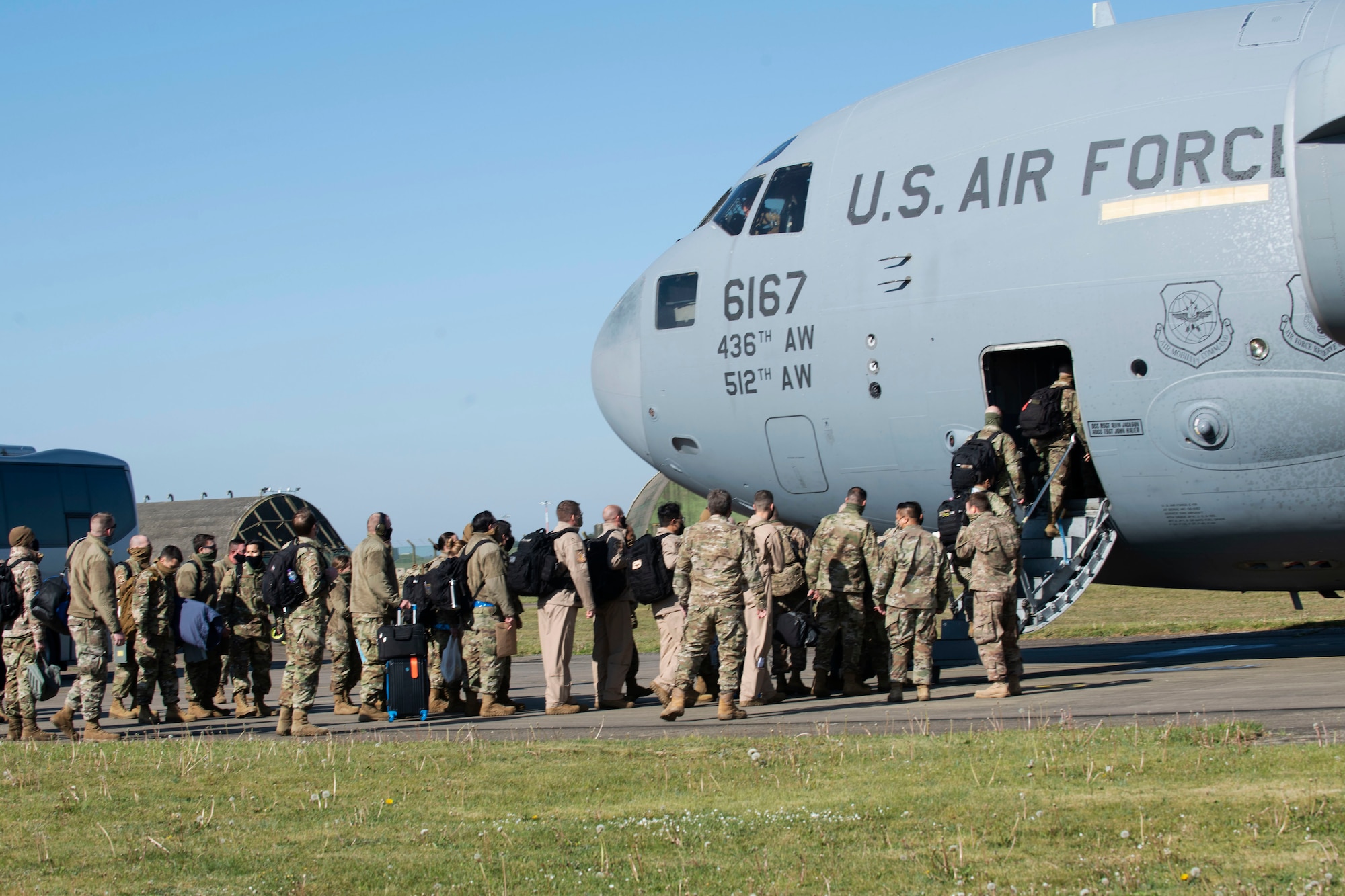 48th Fighter Wing Airmen board a C-17 Globemaster III from Dover Air Force Base, Delaware, in preparation for a deployment from Royal Air Force Lakenheath, England, May 6, 2020. The 492nd Fighter Squadron is the first fighter squadron from the Liberty Wing to deploy since the start of the COVID-19 pandemic. (U.S. Air Force photo by Senior Airman Christopher S. Sparks)
