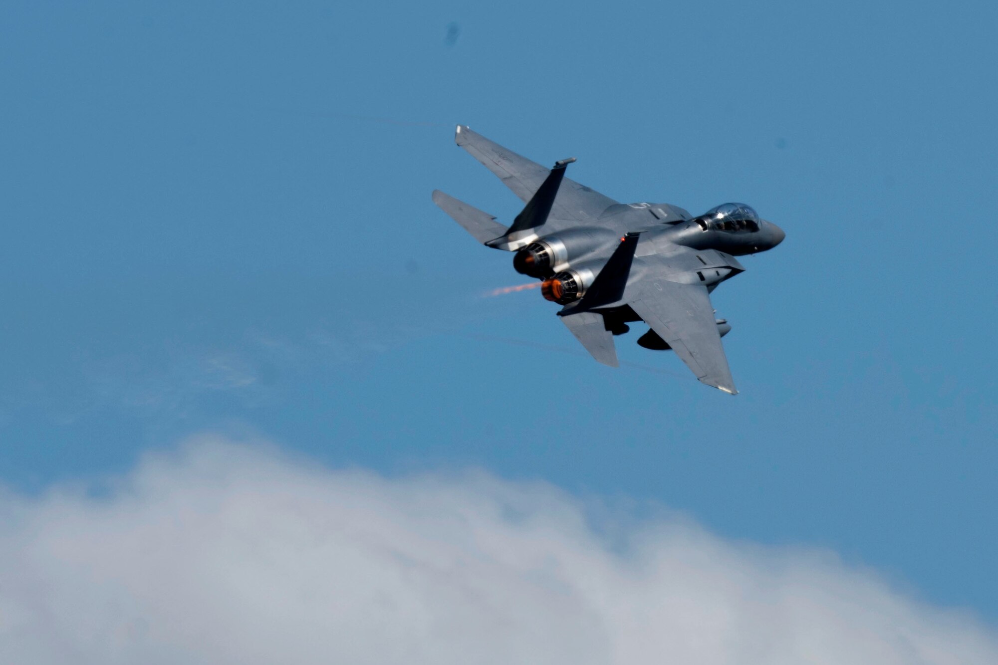 An F-15E Strike Eagle assigned to the 492nd Fighter Squadron flies over Royal Air Force Lakenheath, England, May 6, 2020. F-15E Strike Eagles and Airmen from the 492nd FS and supporting units across the 48th Fighter Wing are currently deployed to an undisclosed location in Southwest Asia. (U.S. Air Force photo by Senior Airman Christopher S. Sparks)