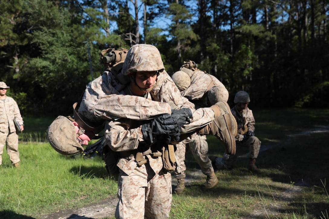 Recruits with Hotel Company, 2nd Recruit Training Battalion, complete the Leadership Reaction Course during the Crucible on Marine Corps Recruit Depot Parris Island, S.C., May 7, 2020. The obstacle course challenges recruits to work together as a team and overcome obstacles. (U.S. Marine Corps photo by Lance Cpl. Devin Darden)