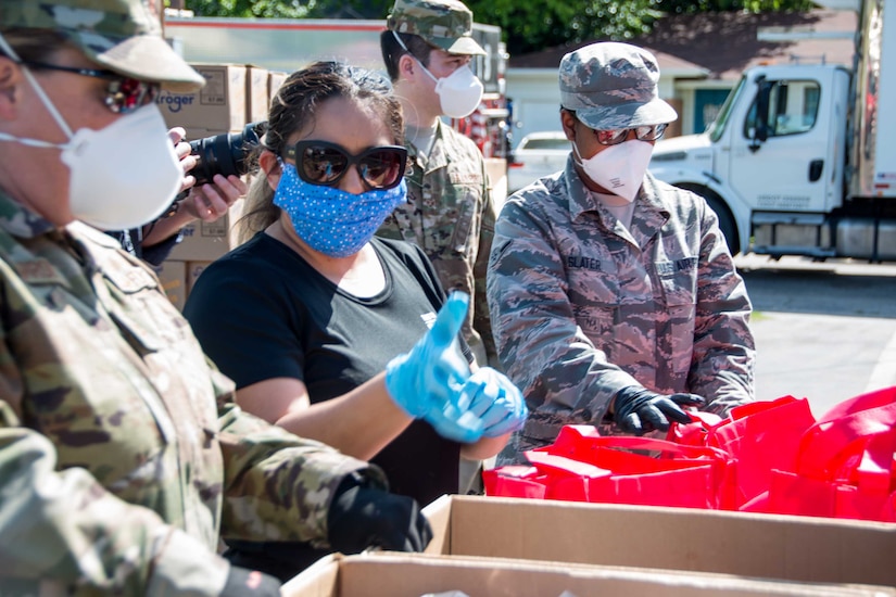 Texas Air National Guard airmen helping at a food bank.