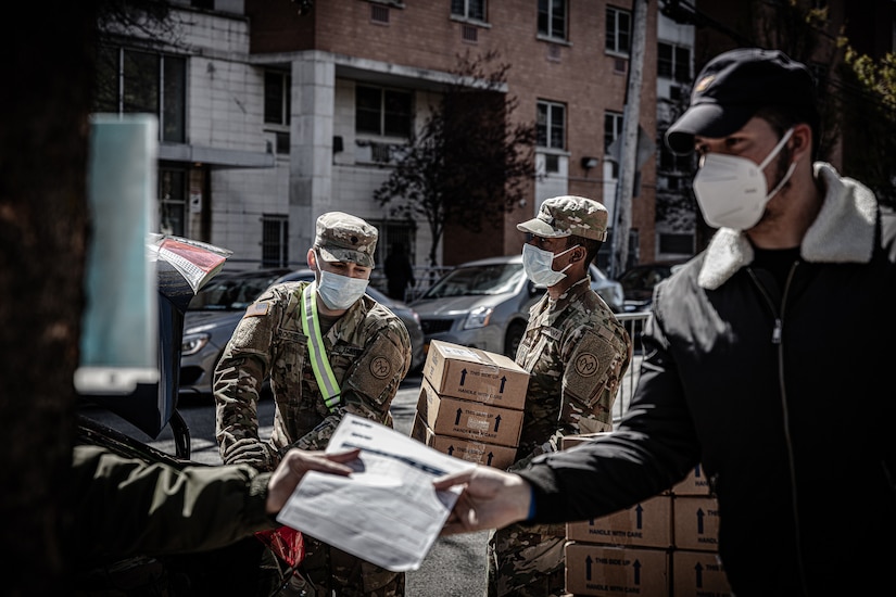 National Guardsmen distributing food.