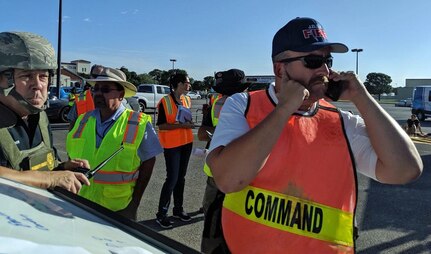 Incident commander Bob Ashley, deputy fire chief at Joint Base San Antonio Fire Emergency Services, communicates information to the Emergency Operations Center and requests additional resources to the scene during a mass casualty exercise at JBSA-Randolph.