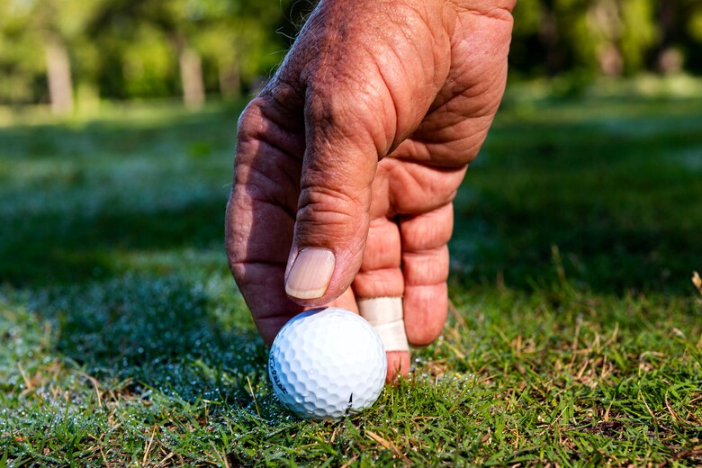 Photo of a patron placing a golf ball.