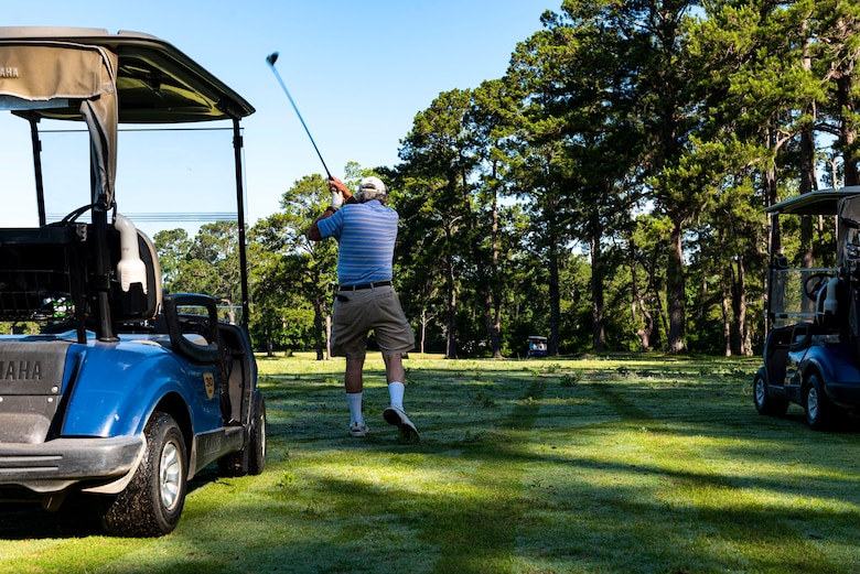 Photo of patron golfing.