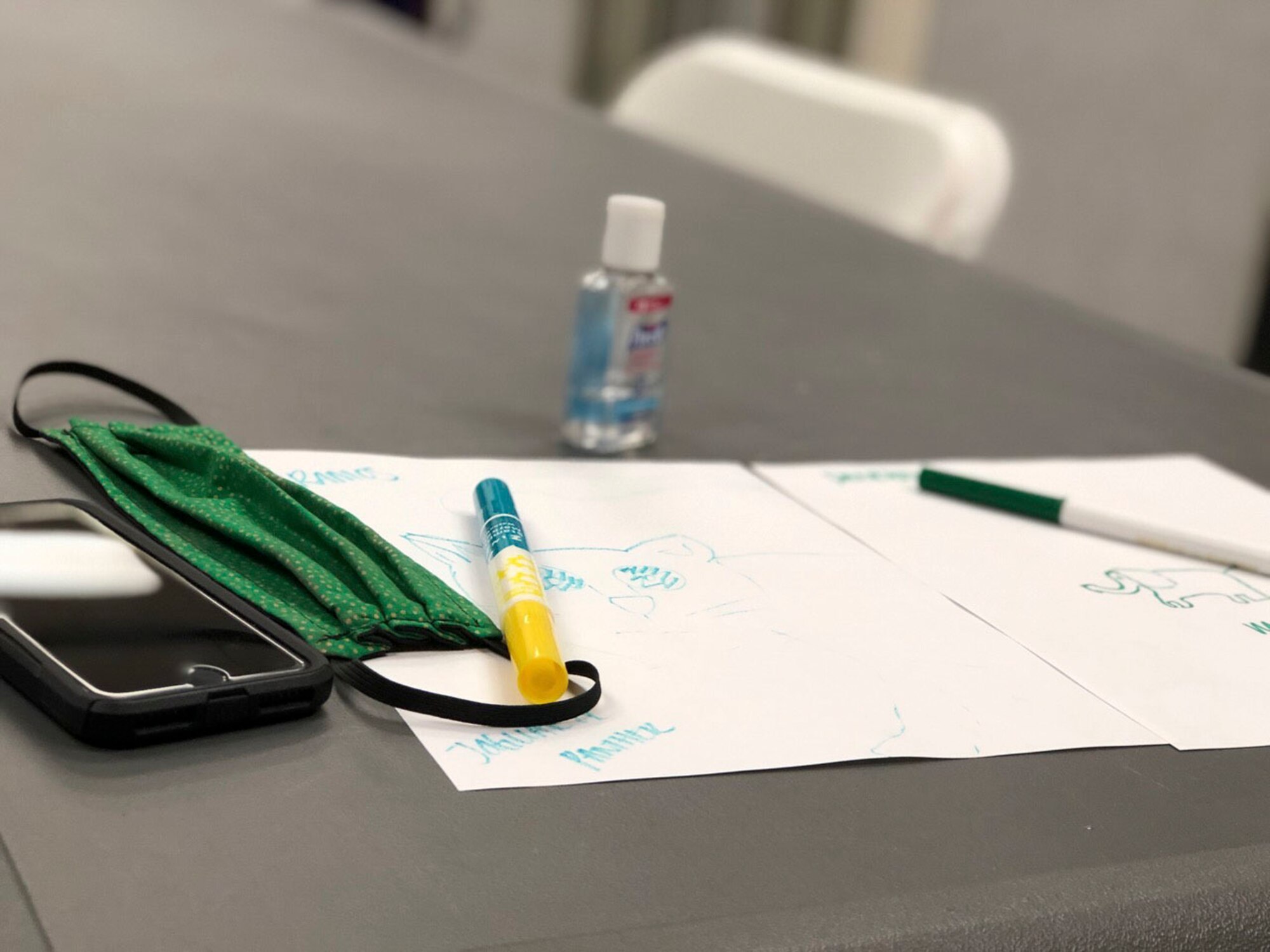 Masks and hand sanitizer are new staples in the Air Force Mortuary Affairs Operations resiliency program where groups of 10 or less gather. In this session, April 23, 2020, deployed mental health technician Staff Sgt. Dani Pierson used creative drawing exercises to help attendees learn more about each other. (U.S. Air Force photo by Master Sgt. Holly Roberts-Davis)