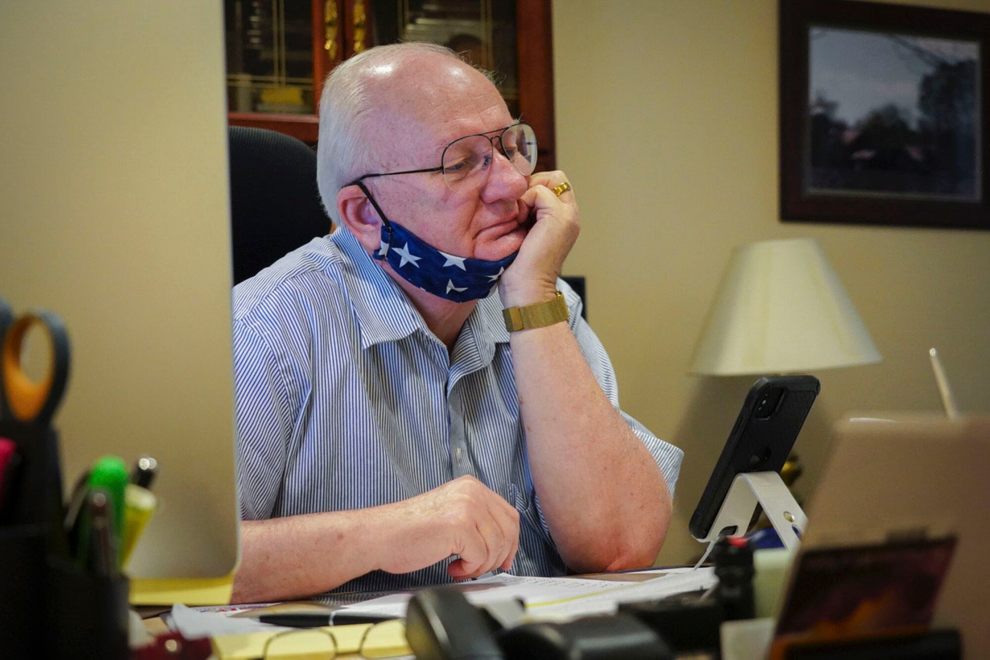 David Sparks, Air Force Mortuary Affairs Operations mortuary chaplain, conducts a virtual online pizza and conversation, May 6, 2020, while at Dover as part of the resiliency program at AFMAO. During a typical Pizza and Conversation session, the chaplain plays a song and then allows participants the chance to discuss what it means to them, but due to physical distancing requirements the event is now held by teleconference. (U.S. Air Force photo by Master Sgt. Holly Roberts-Davis)