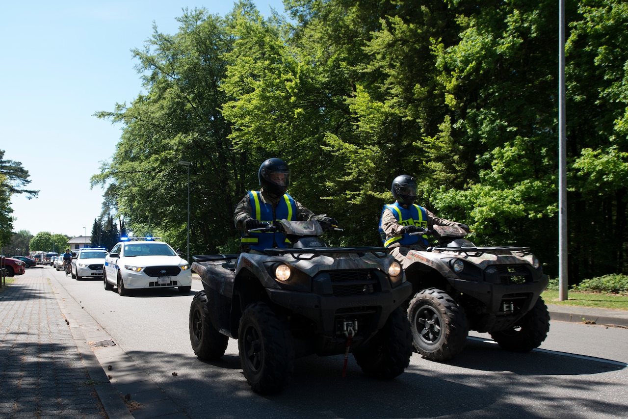 Caravan of police and emergency services vehicles.