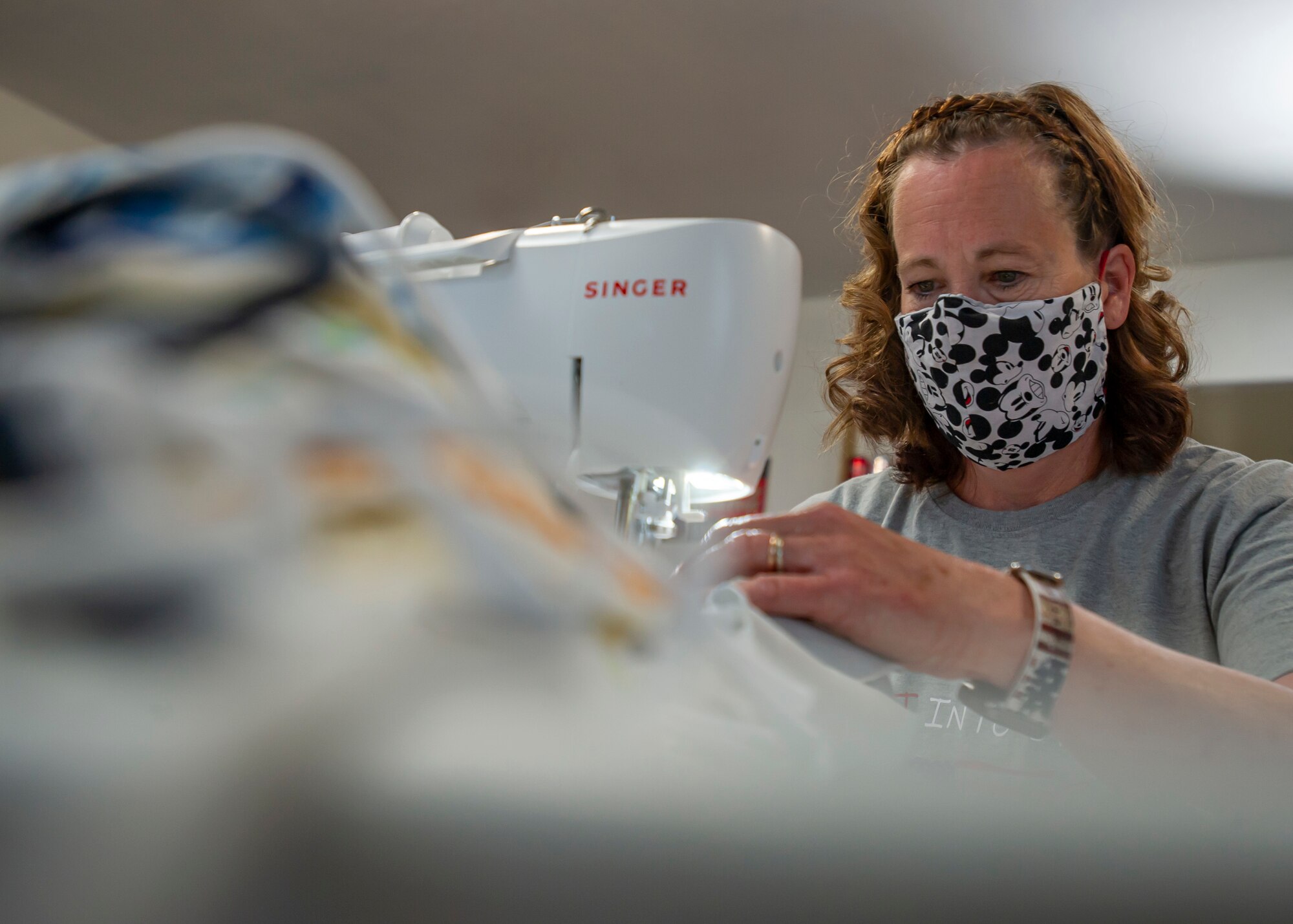 Cynthia Wright sews masks at her home with material from old t-shirts, drapes, and any fabric she can find in stores at her home in Nibley, Utah.