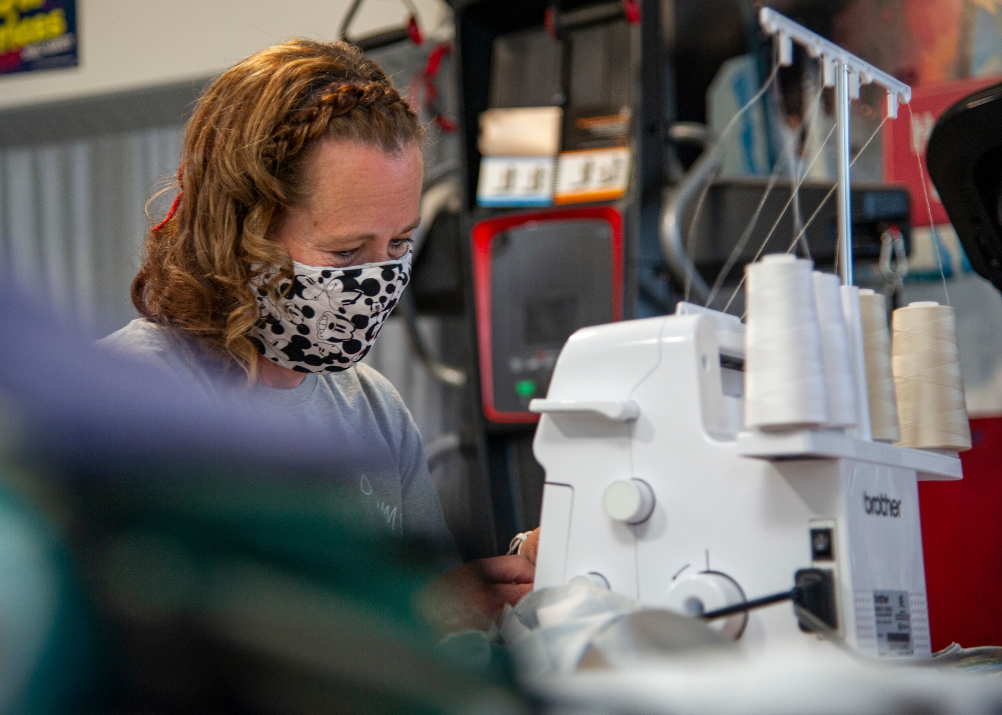 Cynthia Wright sews masks at her home with material from old t-shirts, drapes, and any fabric she can find in stores at her home in Nibley, Utah.