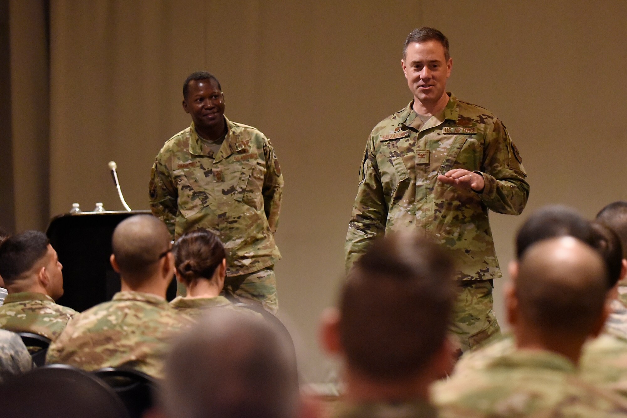 Col. Thomas Falzarano, 21st Space Wing commander, and 21st SW Command Chief, Chief Master Sgt. Jacob Simmons, spoke to the Airmen of Thule Air Base, Greenland during an all call July 19, 2019. At the end of the all call, the 21st SW leadership opened the floor up for questions from the Airmen. (U.S. Air Force photo by Staff Sgt. Alexandra M. Longfellow)