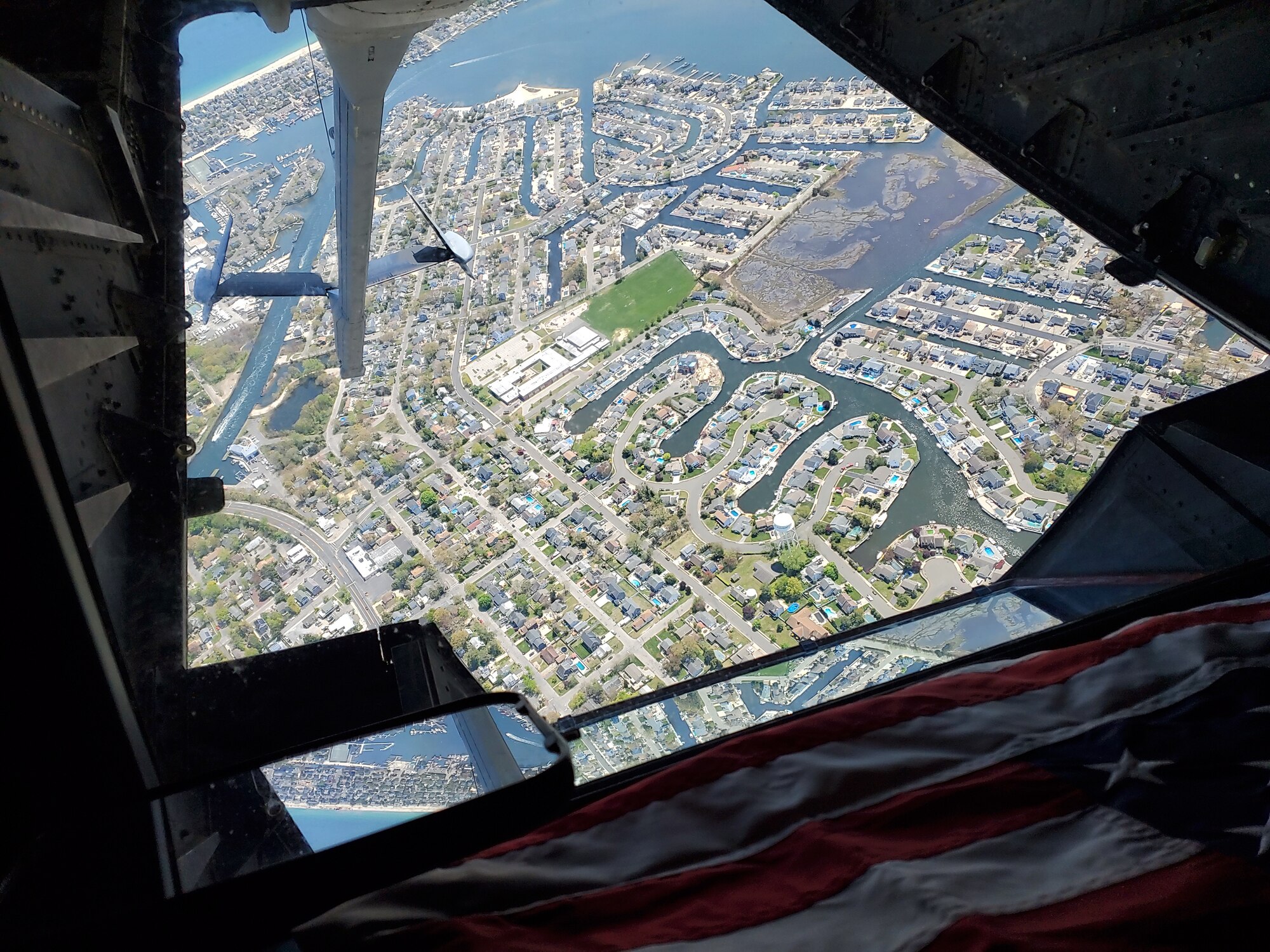 A KC-10 Extender operated by the 76th and 78th Air Refueling Squadron, 514th Air Mobility Wing, Joint Base McGuire-Dix-Lakehurst, N.J., flies over Western New Jersey on May 13, 2020. The 514th performed their scheduled refuel missions in tandem with an #AmericaStrong flyover saluting and thanking all healthcare workers, first responders, and other essential personnel serving on the front lines of the fight against COVID-19. (U.S. Air Force photo by Tech. Sgt. Michael Hong)