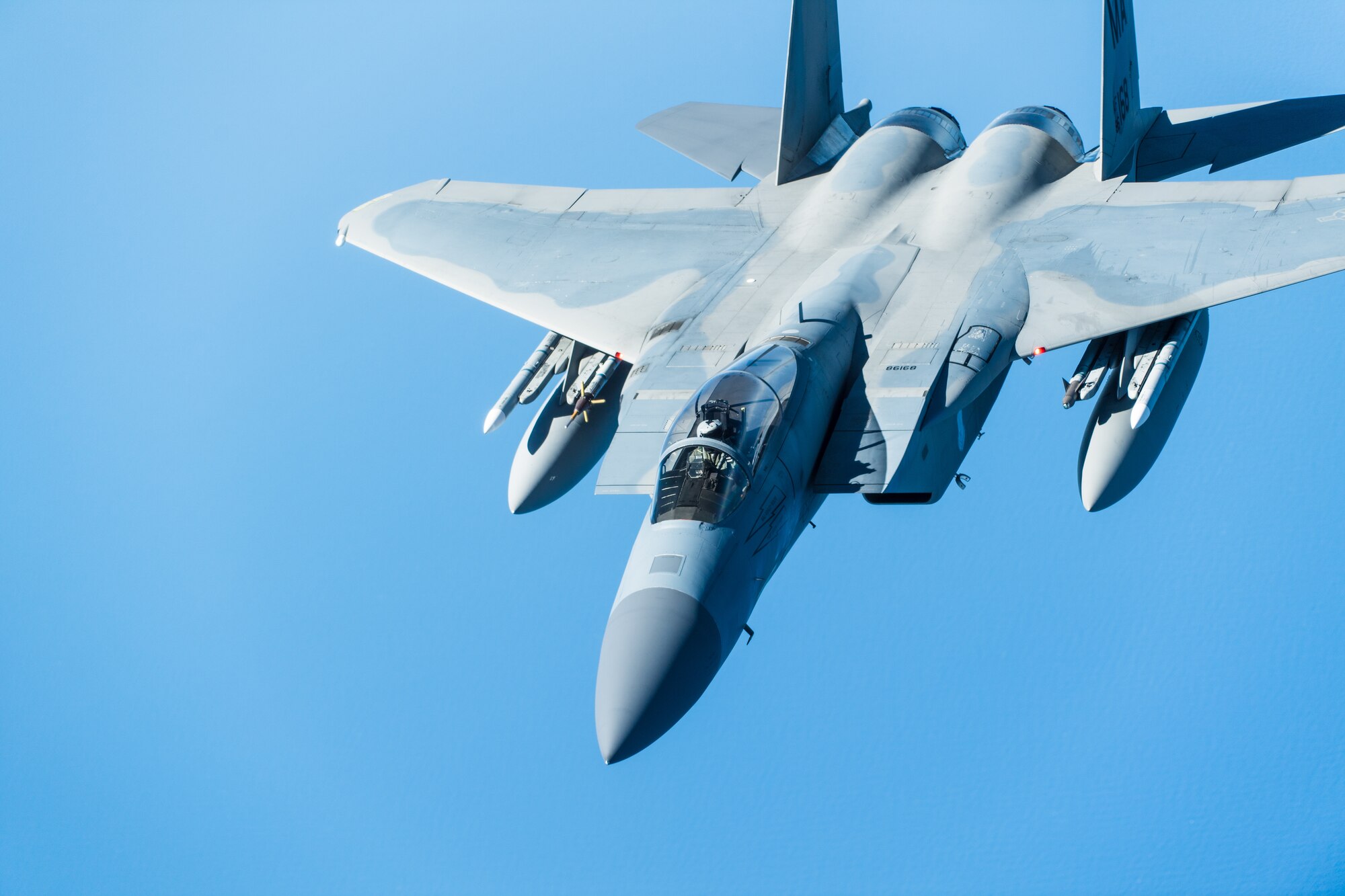 An F-15 C Eagle with the 104th Fighter Wing, Massachusetts Air National Guard, Westfield, Mass., is refueled by a KC-10 Extender operated by the 76th and 78th Air Refueling Squadron, 514th Air Mobility Wing, Joint Base McGuire-Dix-Lakehurst, N.J., on May 13, 2020. The 514th performed their scheduled refuel missions in tandem with an #AmericaStrong flyover saluting and thanking all healthcare workers, first responders, and other essential personnel serving on the front lines of the fight against COVID-19. (U.S. Air Force photo by Tech. Sgt. Michael Hong)