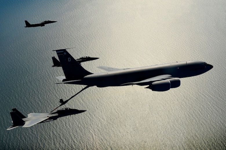 A KC-135 Stratotanker assigned to the 100th Air Refueling Wing conducts aerial operations with F-15 aircraft assigned to the 48th Fighter Wing in support of exercise Point Blank 20-02 over the North Sea, May 12, 2020. The joint event, held quarterly between the Royal Air Force and U.S. Air Forces stationed in the United Kingdom was the first to be conducted amid the COVID-19 pandemic. (U.S. Air Force photo/ Master Sgt. Matthew Plew)
