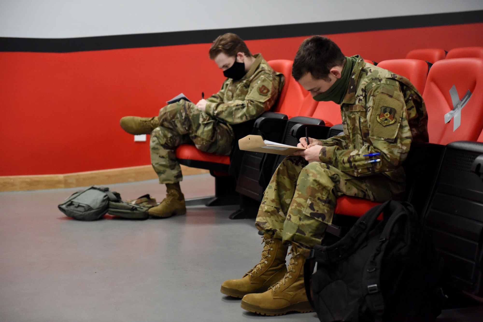 Two Airmen assigned to the 492nd Fighter Squadron maintain social distancing while completing pre-deployment line tasks at Royal Air Force Lakenheath, England, May 6, 2020. F-15E Strike Eagles and Airmen from the 492nd FS and supporting units across the 48th Fighter Wing are currently deployed in support of Operation Inherent Resolve. (U.S. Air Force photo by Senior Airman Christopher S. Sparks)