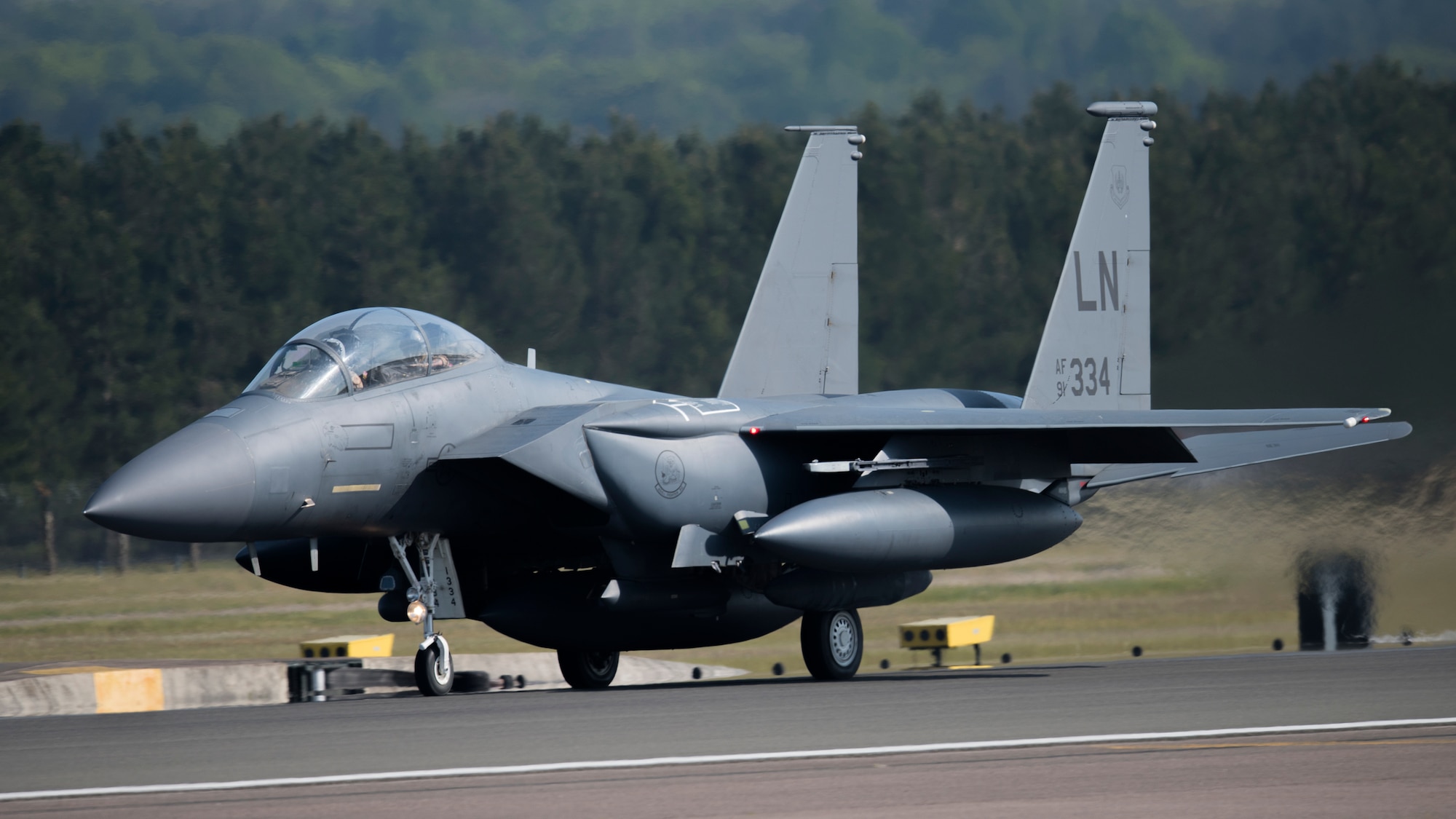 An F-15E Strike Eagle assigned to the 492nd Fighter Squadron takes off from Royal Air Force Lakenheath, England, May 7, 2020. The 492nd FS is the first of the three fighter squadrons at the Liberty Wing to deploy during the current COVID-19 pandemic. (U.S. Air Force photo by Airman 1st Class Jessi Monte)