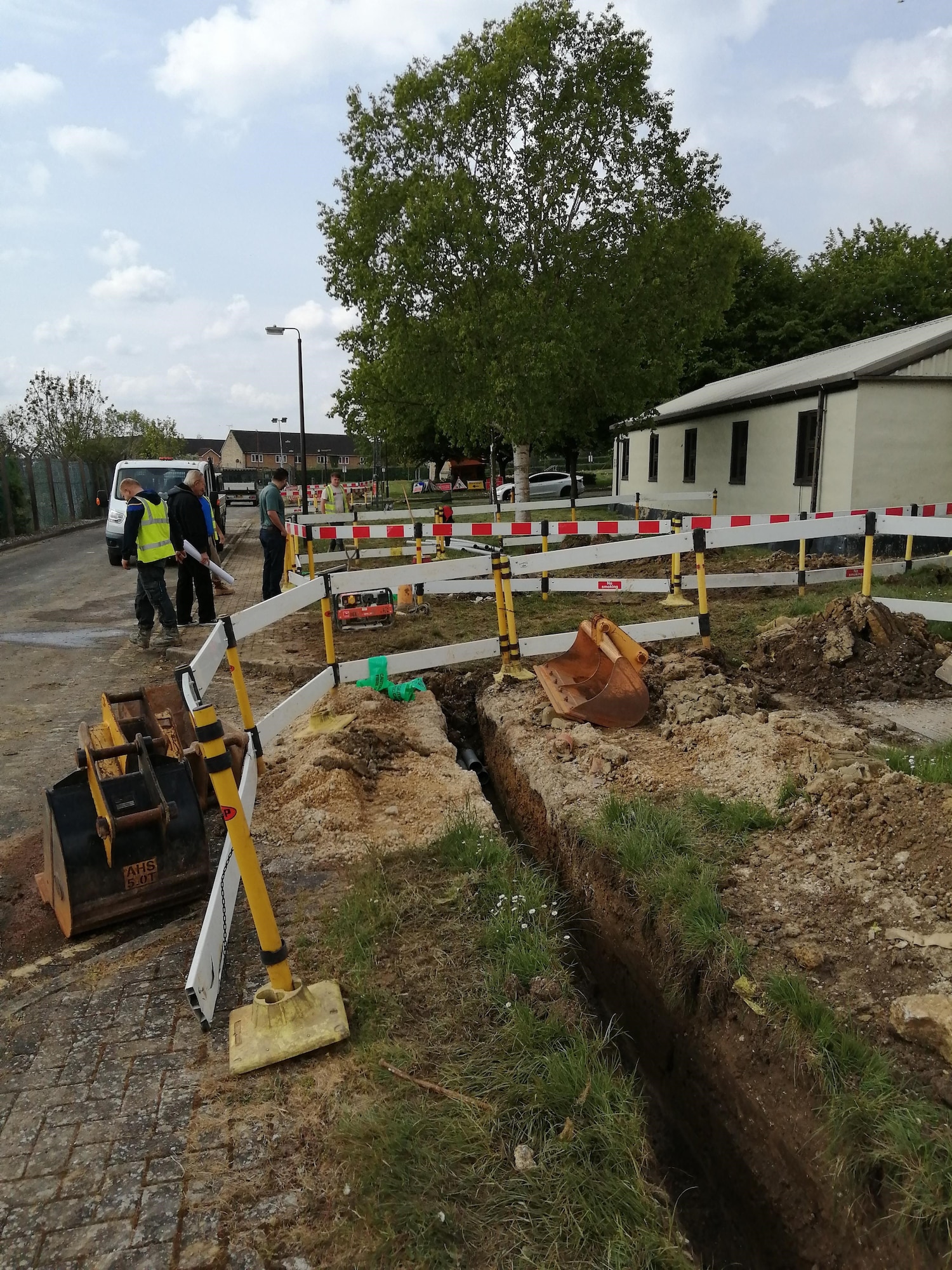 Contractors install new communication lines at RAF Fairford, England, May 4, 2020. Run by the 501st Combat Support Wing Plans and Programs Office, the project aims to recapitalize information technology infrastructure around the base, ensuring its networks are resilient and reliable for an expanding mission set (Courtesy photo)