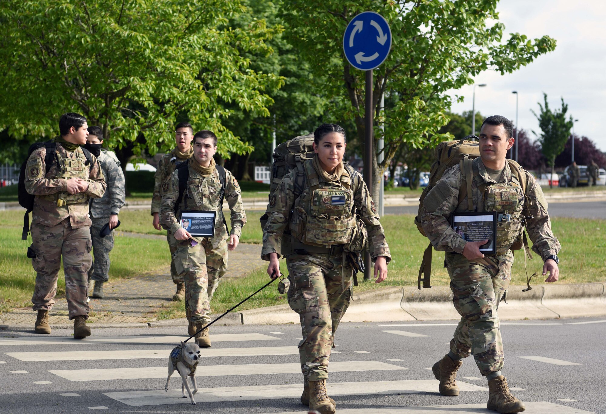Airmen from the 100th Security Forces Squadron march during the 100th SFS Memorial Ruck March to commemorate National Police Week at RAF Mildenhall, England, May 13, 2020. National Police Week is an observance in the United States which pays tribute to local, state and federal officers who’ve died or who’ve been disabled in the line of duty. (U.S. Air Force photo by Senior Airman Brandon Esau)