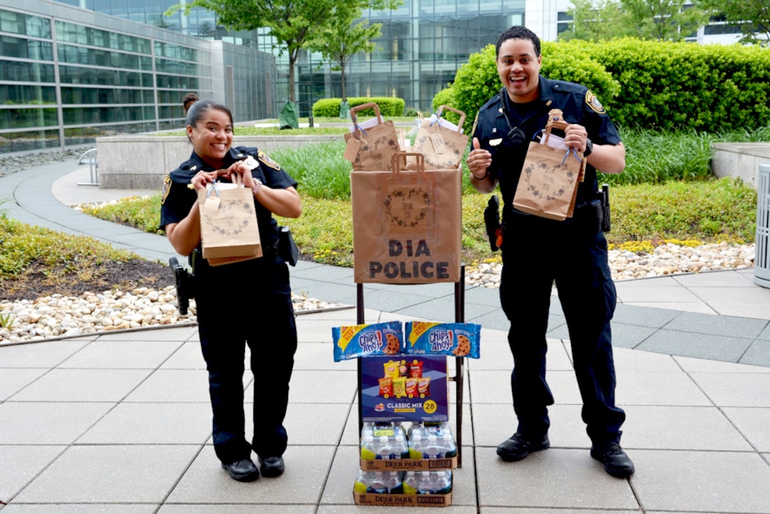 DIA Police Sgt. Nicolet Gibbs and Officer Aaron Maxwell excitedly received thank you cards, goodie bags, snacks and water, all of which were provided by the Agency’s Belinda Justice of CIO.