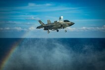 SOUTH CHINA SEA (April 18, 2020) An F-35B Lightning II fighter aircraft with Marine Medium Tiltrotor Squadron (VMM) 265 (Reinforced), 31st Marine Expeditionary Unit (MEU), prepares to land on the flight deck of amphibious assault ship USS America (LHA 6) during flight operations. Marines and Sailors aboard the America regularly conduct flight operations while underway to maintain their readiness to respond to contingencies. America, flagship of the America Expeditionary Strike Group, 31st MEU team, is operating in the U.S. 7th Fleet area of operations to enhance interoperability with allies and partners and serve as a ready response force to defend peace and stability in the Indo-Pacific region. (U.S. Marine Corps photo by Sgt. Audrey M. C. Rampton)