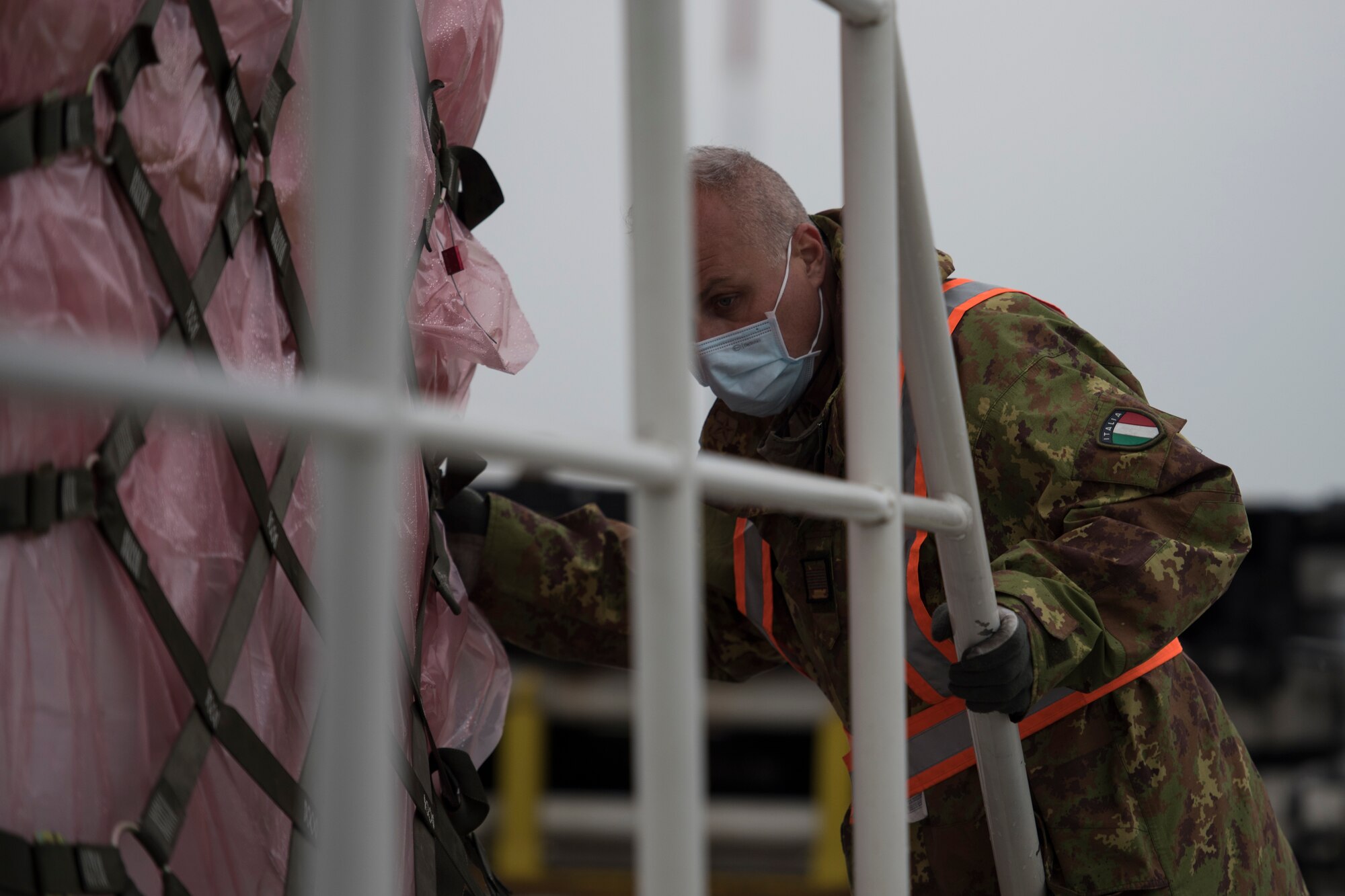 man inspects cargo