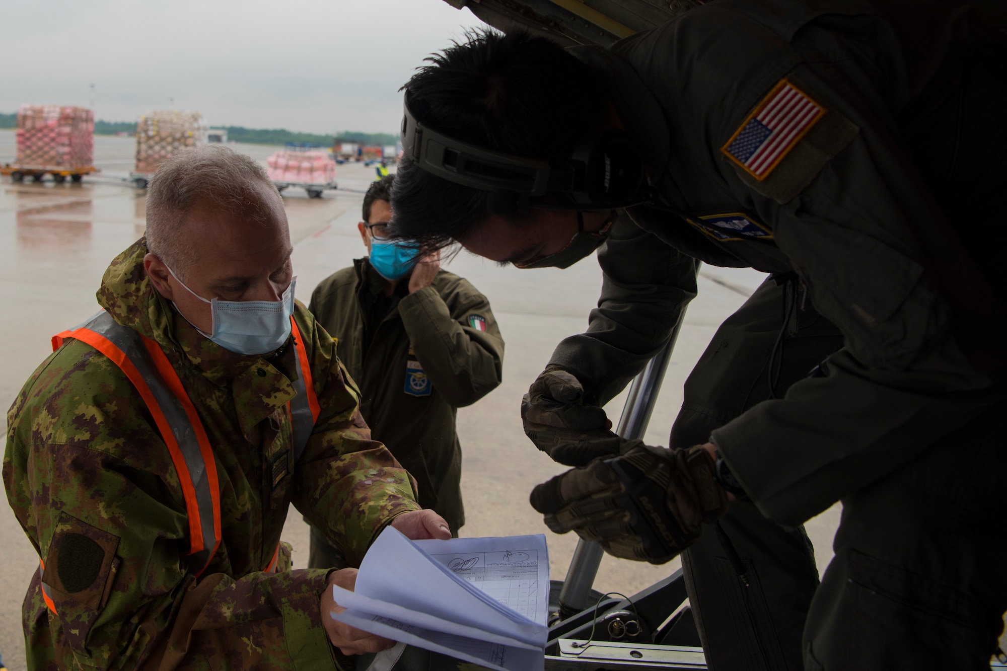 man inspects documents