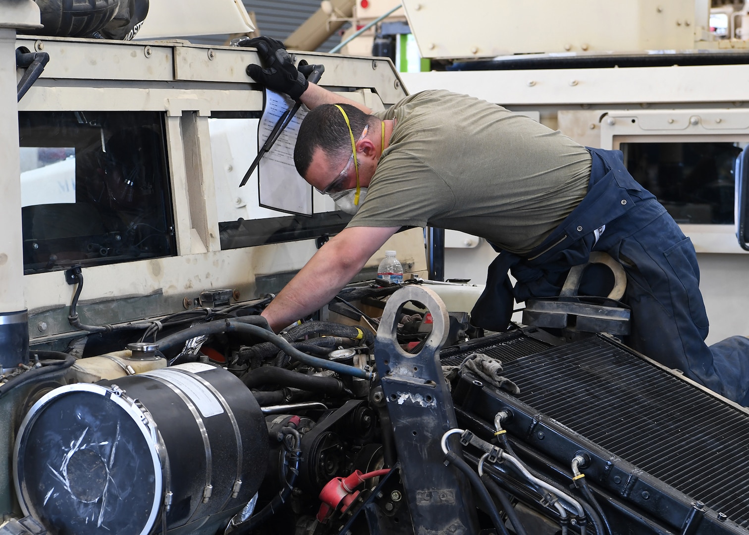 U.S. Army Spc. Koby Riggan, a radio technician with the California Army National Guard’s 270th Military Police Company, works on a Humvee, April 28, 2020, at the Cal Guard's Field Maintenance Shop 22, in Sacramento. The Cal Guard has been using these vehicles to support humanitarian missions throughout the state.
