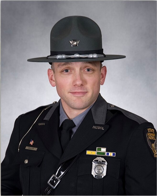 Staff Sgt. Brandon Miller, a heating, ventilation, air conditioning, and refrigeration (HVACR) technician at the 910th Civil Engineer Squadron and Ohio State Highway Patrolman at the Ashtabula post in Ohio poses for an official photo in his state patrolman uniform. Miller has been an Ohio State Highway Patrolman since 2011.