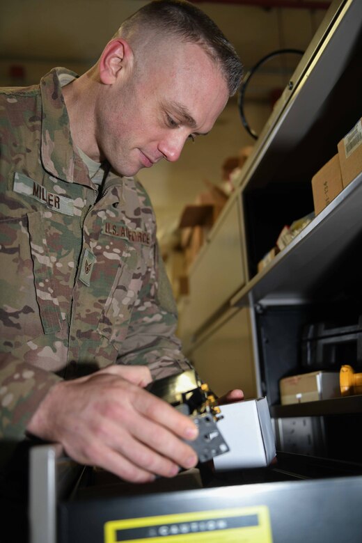 Staff Sgt. Brandon Miller, a heating, ventilation, air conditioning and refrigeration (HVACR) technician at the 910th Civil Engineer Squadron at YARS and Ohio State Highway Patrolman at the Ashtabula post in Ohio organizes a components drawer after completing a job at YARS, Jan. 12, 2020.