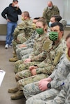 Pennsylvania National Guard members prepare to enter Brighton Rehab and Wellness Center in Beaver, Pennsylvania, May 10, 2020. About 40 Guard members are assisting with medical, administrative and cleaning services at the facility.