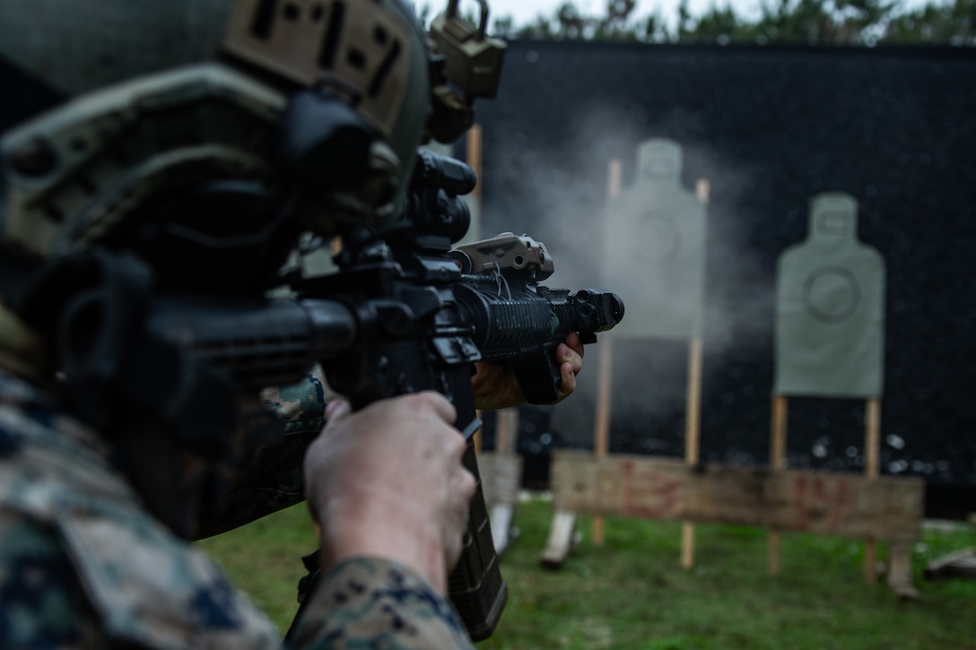 A U.S. Marine fires his M4A1 service rifle during a modified qualification as part of a close-quarters tactics range on Camp Hansen, Okinawa, May 11.