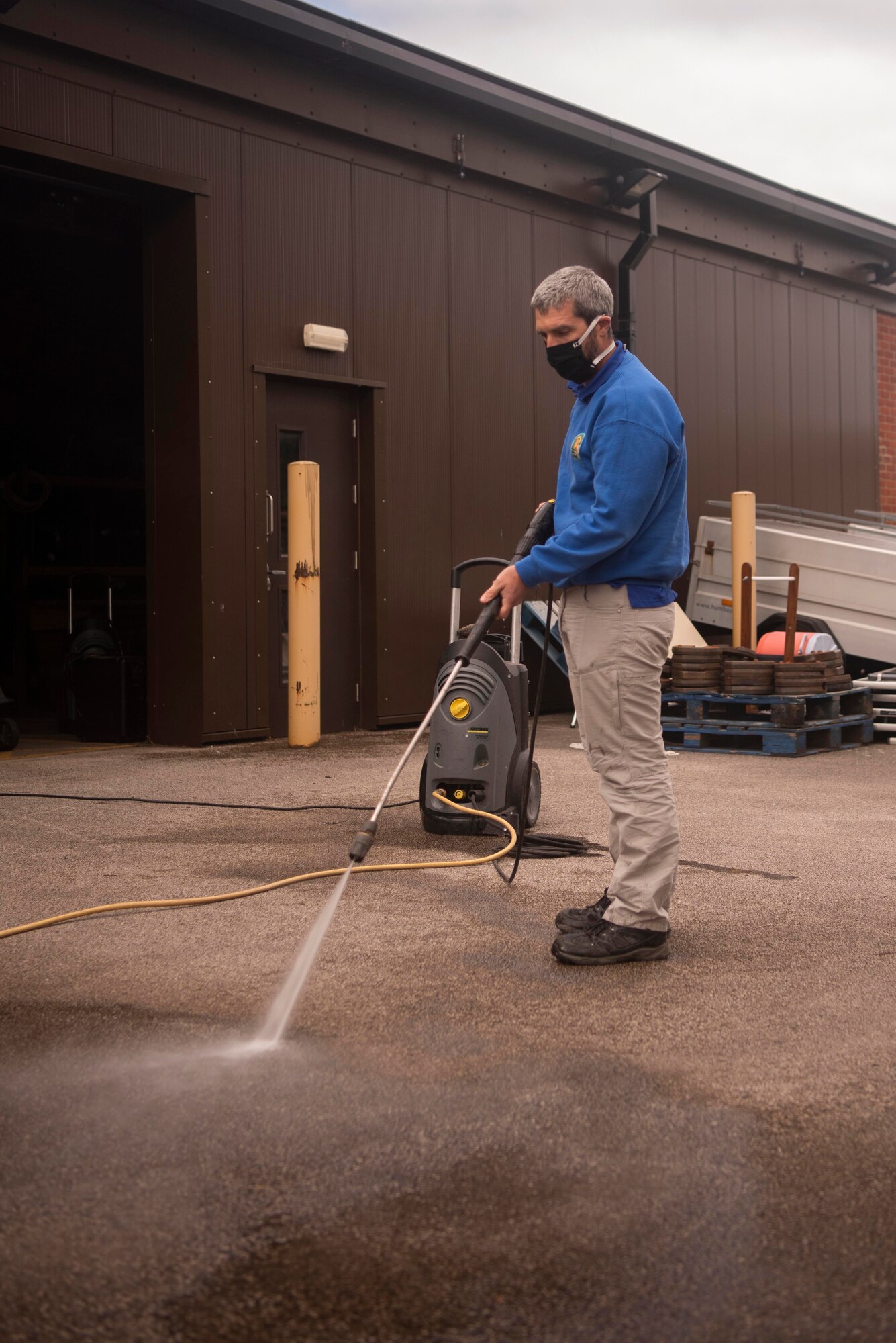 Keith Thomas, 100th Force Support Squadron Outdoor Recreation rental manager, tests the function of a pressure washer outside the outdoor recreation center at RAF Mildenhall, England, May 11, 2020. A variety of household tools and equipment are available to rent from the center for daily and weekly rates. (U.S. Air Force photo by Airman 1st Class Joseph Barron)