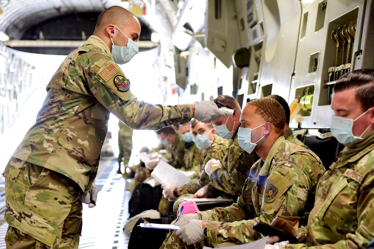 Airman taking temperatures.