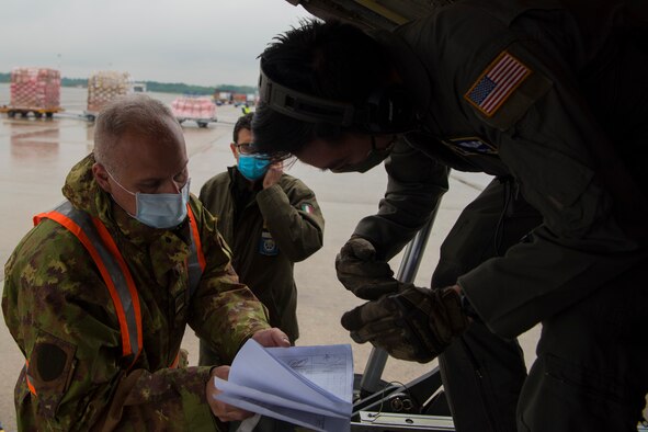 man inspects documents