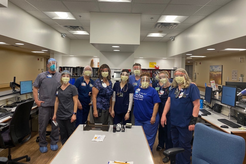 Health care workers posing for a photo.