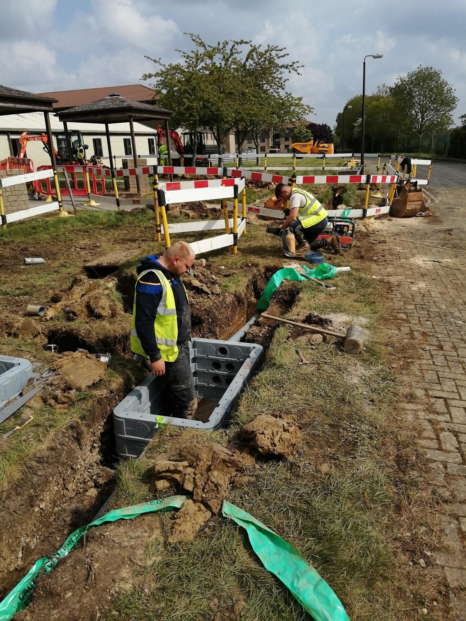 Contractors install new communication lines at RAF Fairford, England, May 4, 2020. Run by the 501st Combat Support Wing Plans and Programs Office, the project aims to recapitalize information technology infrastructure around the base, ensuring its networks are resilient and reliable for an expanding mission set (Courtesy photo)