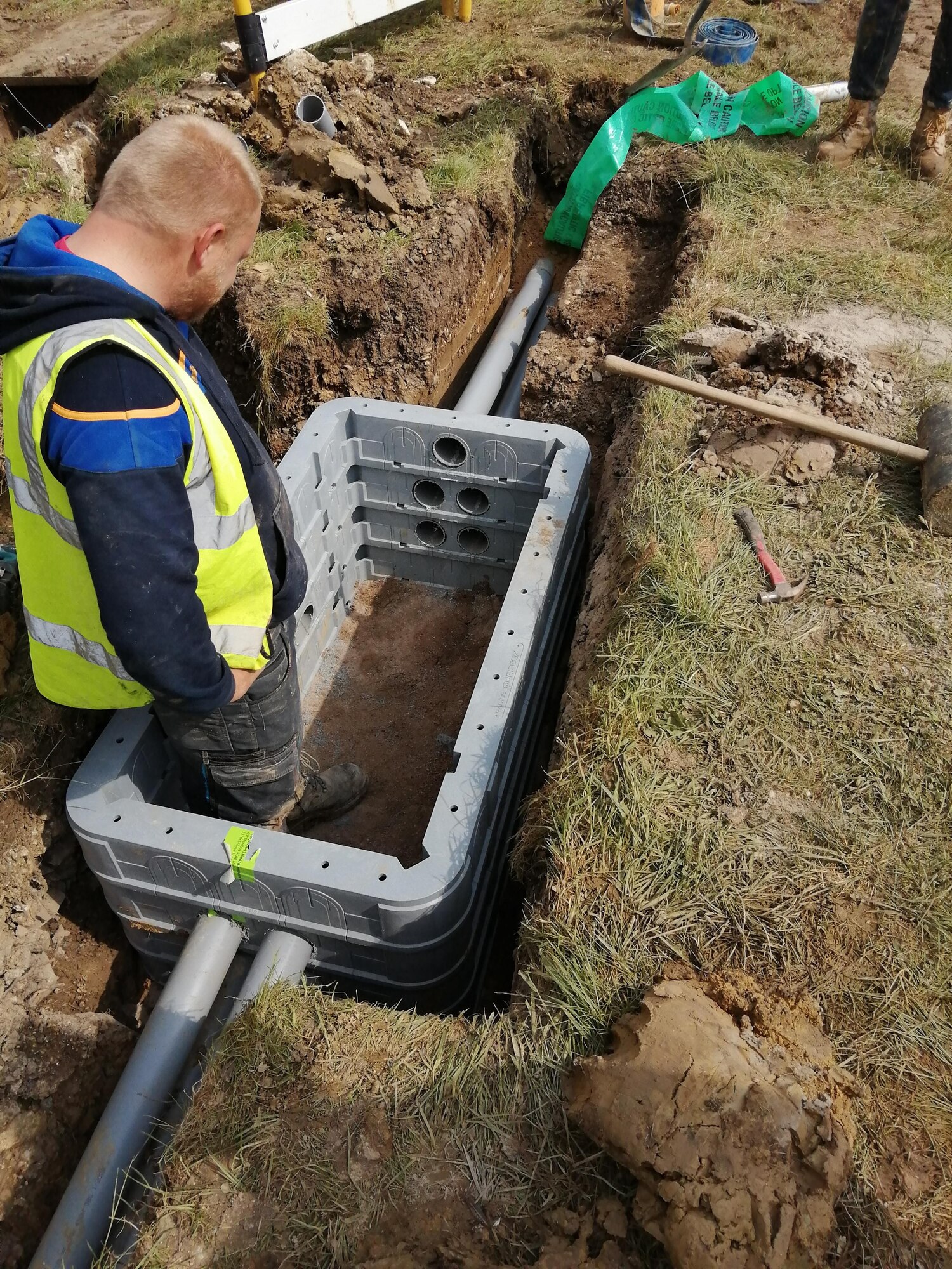 Contractors install new communication lines at RAF Fairford, England, May 4, 2020. Run by the 501st Combat Support Wing Plans and Programs Office, the project aims to recapitalize information technology infrastructure around the base, ensuring its networks are resilient and reliable for an expanding mission set (Courtesy photo)