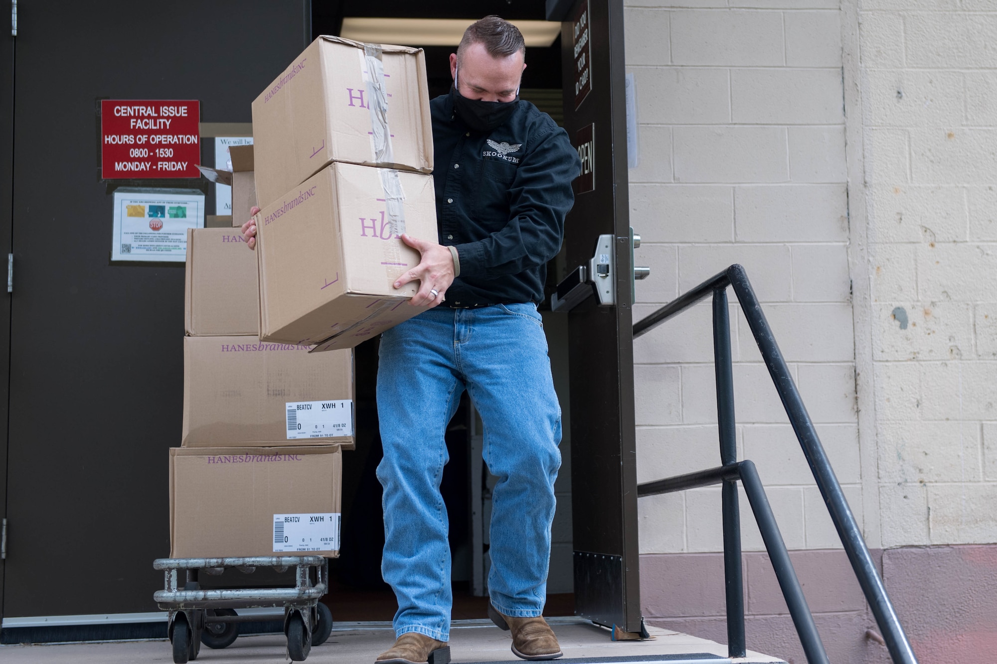 Josh Howe, Central Issue Facility supply technician, carries boxes of face mask at Joint Base Langley-Eustis, Virginia, May 13, 2020. A commercial vendor donated 7.5 million masks to the U.S. Army. (U.S. Air Force photo by Senior Airman Derek Seifert)