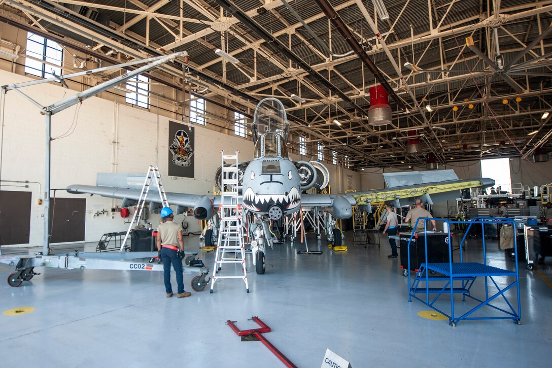A photo of Airmen working on an A-10