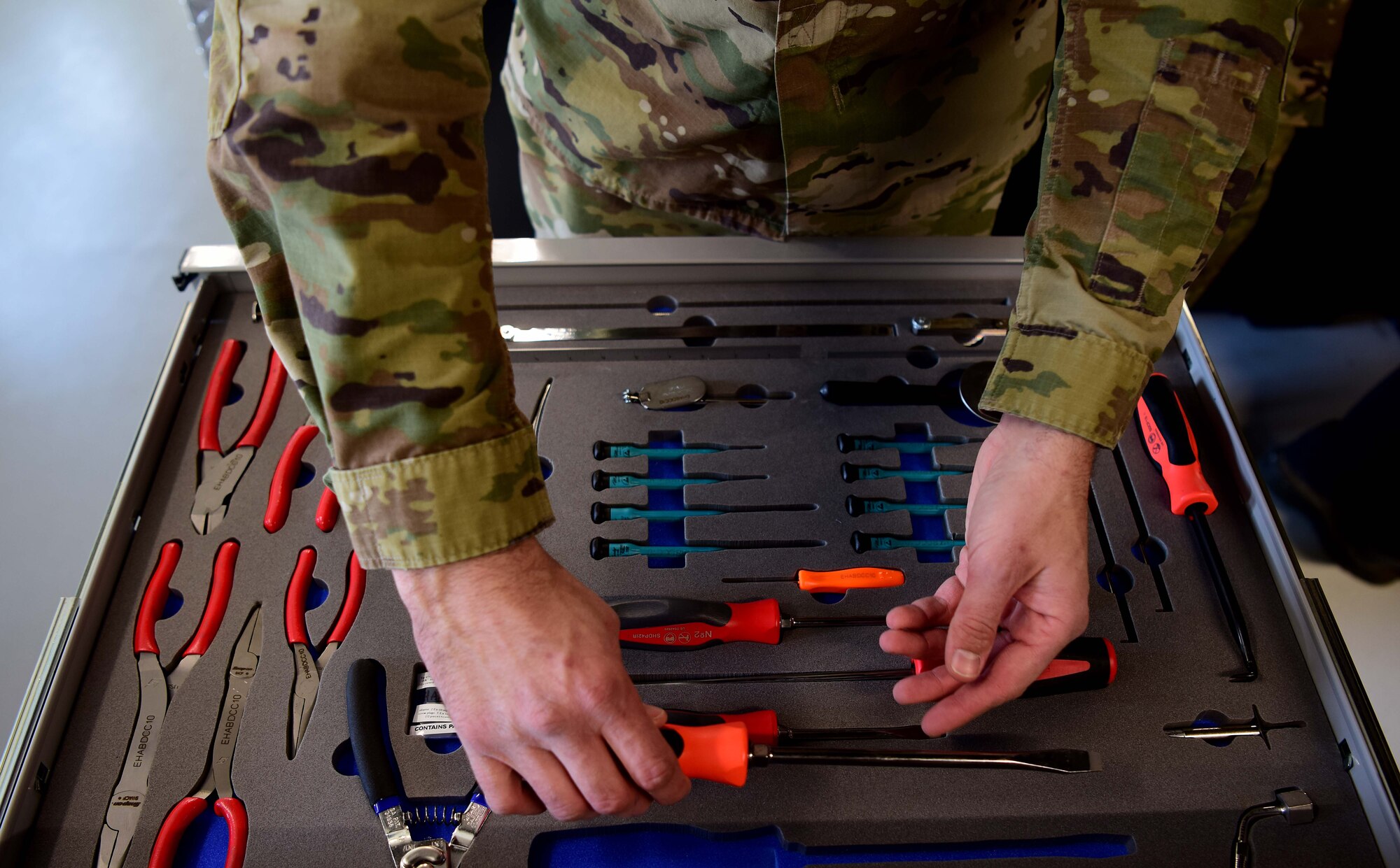 U.S. Air Force Staff Sgt. Christopher Mashek, a 356th Aircraft Maintenance Unit F-35A Lightning II crew chief, inspects his tool kit prior to heading out to the flight line at Eielson Air Force Base, Alaska, May 1, 2020.