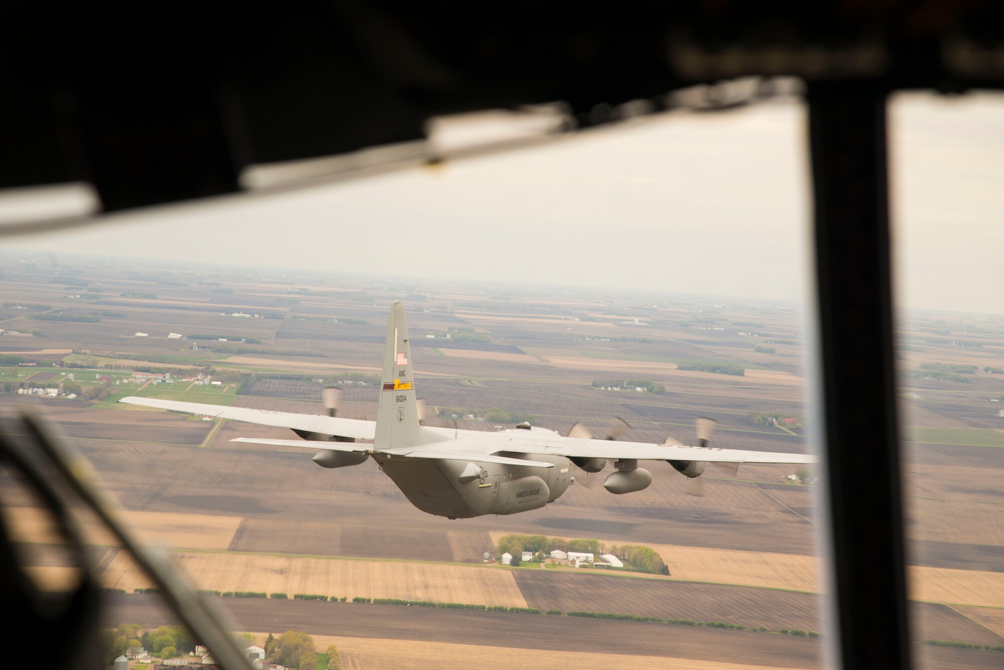 A U.S. Air Force C-130 from the 133rd Airlift Wing flies with a C-130 from the 934th Airlift Wing during a flyover in Minnesota, May 13, 2020. The 934th Airlift Wing along with the Minnesota National Guard’s 133rd Airlift Wing flew statewide flyovers in recognition of those on the frontlines of the COVID-19 pandemic response as part of Operation American Resolve. (U.S. Air Force photo by Chris Farley)