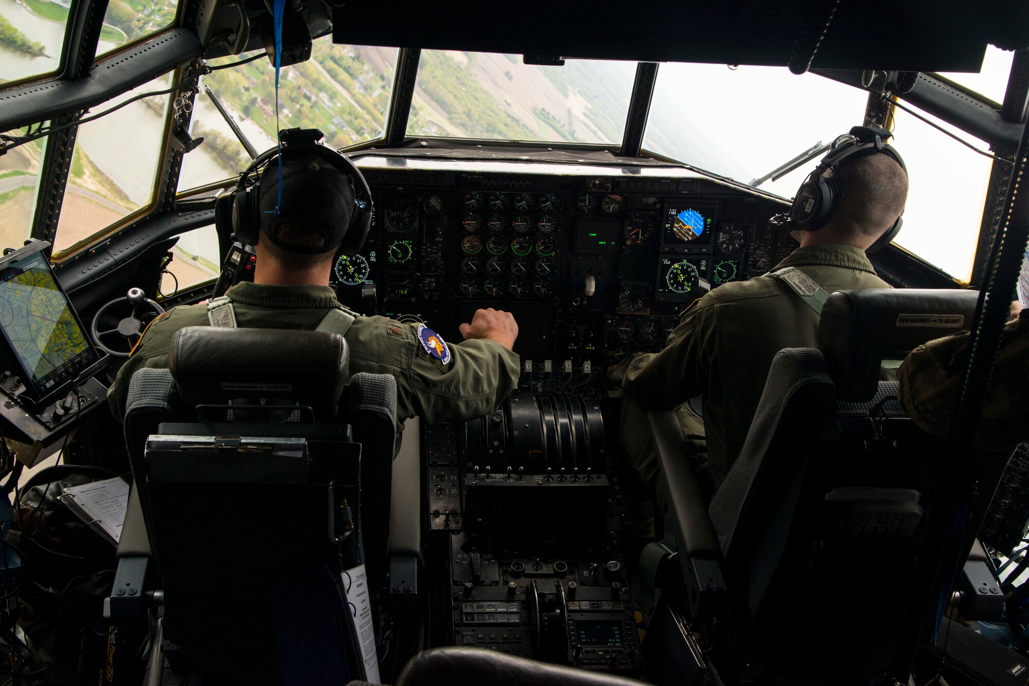 Maj. Ethan Bryant and Capt. Mike McFadden, both are pilots with the 96th Airlift Squadron, fly a U.S. Air Force C-130 during a flyover in Minnesota, May 13, 2020. The 934th Airlift Wing along with the Minnesota National Guard’s 133rd Airlift Wing flew statewide flyovers in recognition of those on the frontlines of the COVID-19 pandemic response as part of Operation American Resolve. (U.S. Air Force photo by Chris Farley)